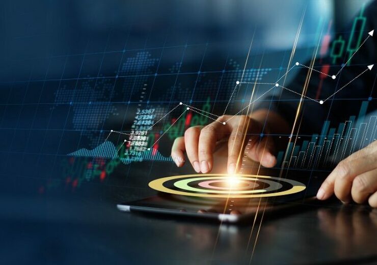 Businessman,Touching,Pie,Chart,On,Tablet,And,Analyzing,Sales,Data
